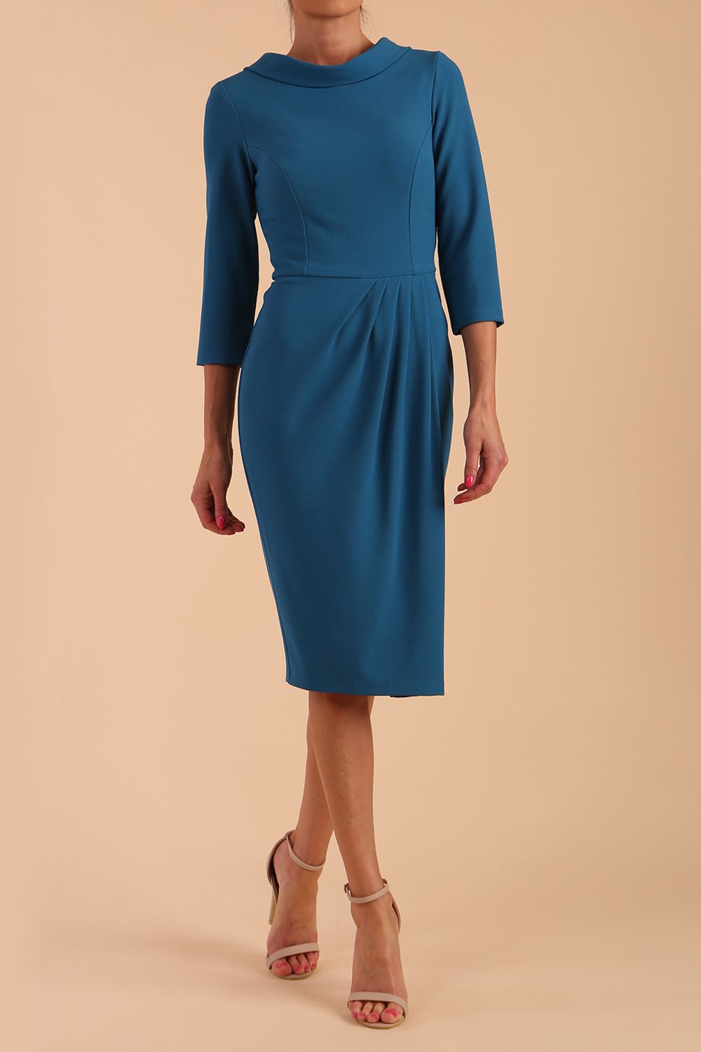 Model wearing diva catwalk Hazel pencil skirt dress with 3/4 sleeved in Tropical Teal side