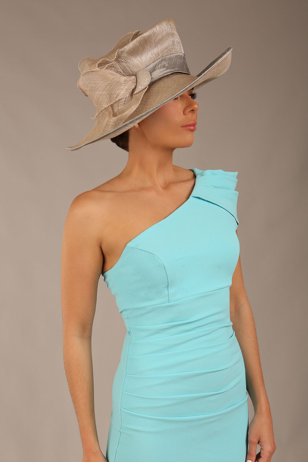 A Brunette Model is wearing a diva catwalk Phoebe One Shoulder Pencil Dress in knee length side vent - turquoise front 