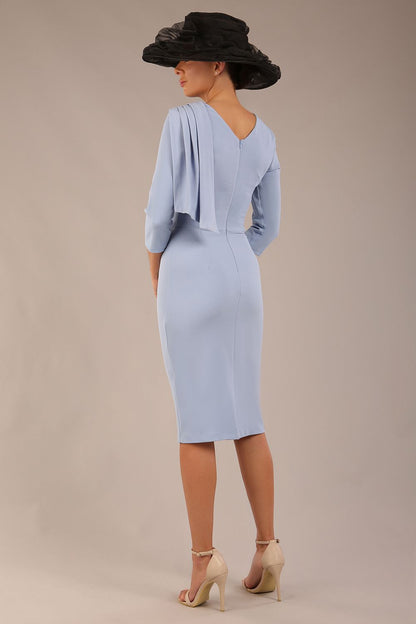 brunette model is wearing a diva catwalk Frieth Gathered Shoulder Dress 3/4 sleeves knee length with shoulder detail in powder blue colour front image