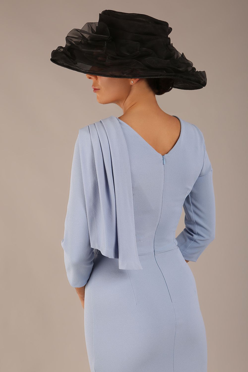 brunette model is wearing a diva catwalk Frieth Gathered Shoulder Dress 3/4 sleeves knee length with shoulder detail in powder blue colour front image