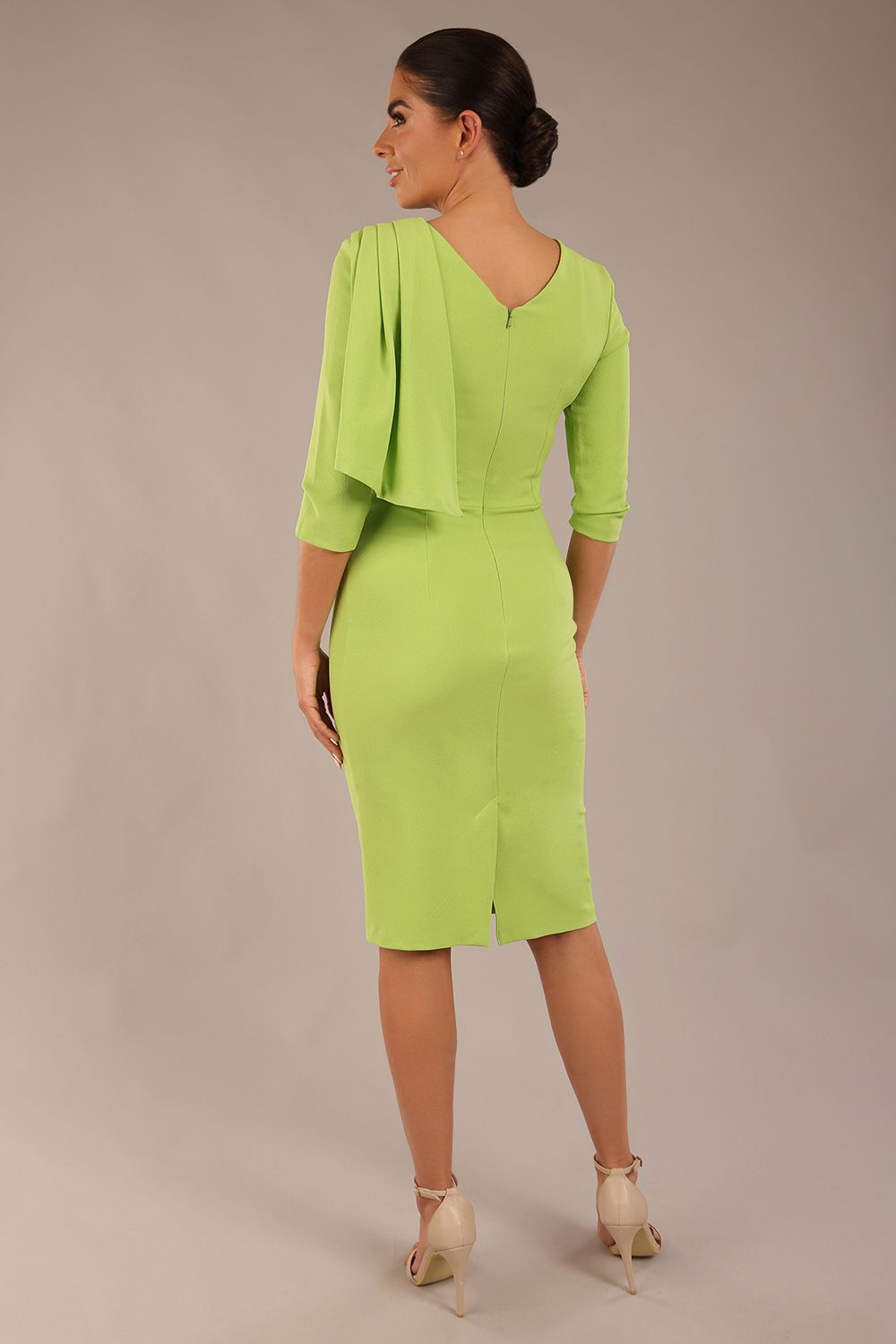 brunette model is wearing a diva catwalk Frieth Gathered Shoulder Dress 3/4 sleeves knee length with shoulder detail in paradise green colour back image close up