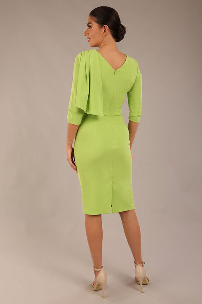 brunette model is wearing a diva catwalk Frieth Gathered Shoulder Dress 3/4 sleeves knee length with shoulder detail in paradise green colour back image close up
