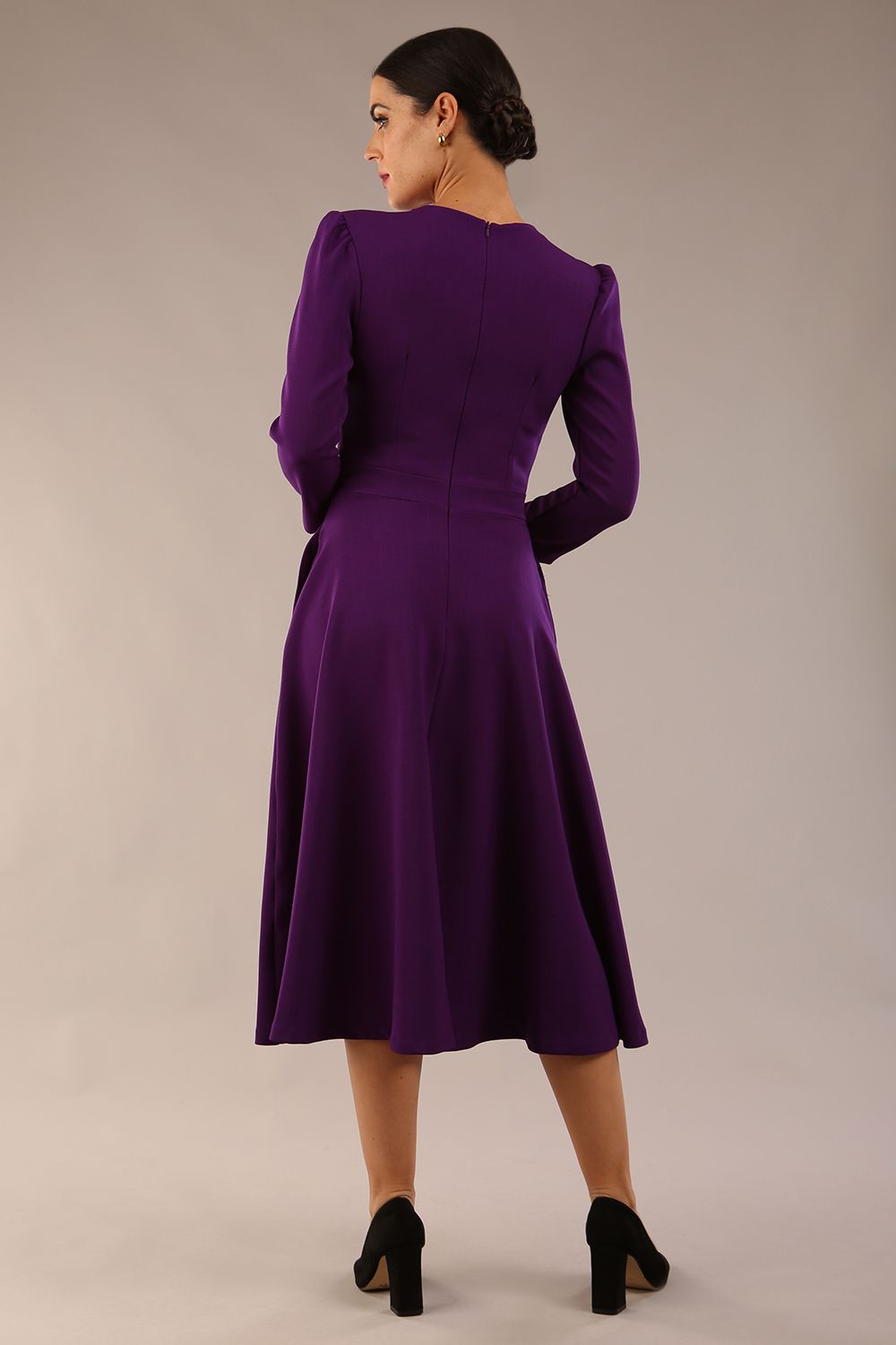 Model wearing diva catwalk Kate 3/4 Length Sleeve A-Line Swing Dress with pockets in Deep Purple front