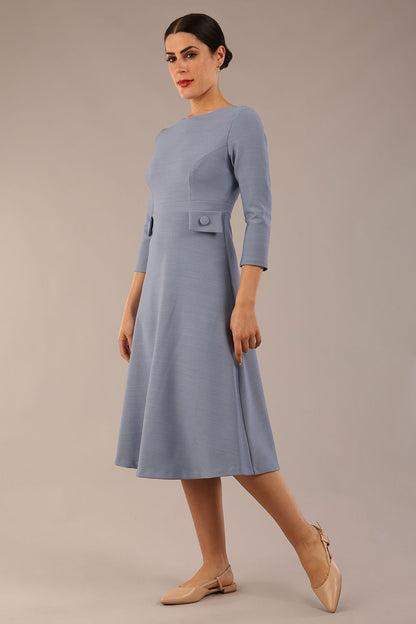 Model wearing diva catwalk Gresham 3/4 Sleeve Knee Length A-Line Dress in Steel Blue side front
