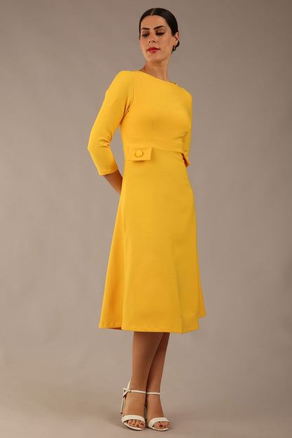 Model wearing diva catwalk Gresham 3/4 Sleeve Knee Length A-Line Dress in Daffodil Yellow side