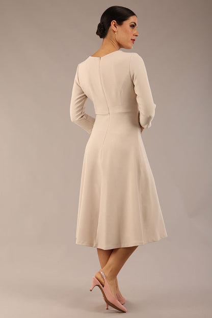 Model wearing diva catwalk Gresham 3/4 Sleeve Knee Length A-Line Dress in Sandy Cream