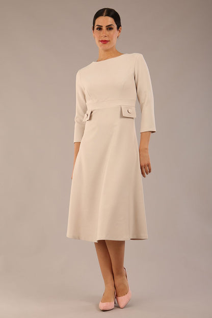 Model wearing diva catwalk Gresham 3/4 Sleeve Knee Length A-Line Dress in Sandy Cream