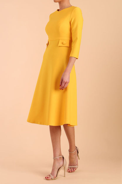 Model wearing diva catwalk Gresham 3/4 Sleeve Knee Length A-Line Dress in Daffodil Yellow side