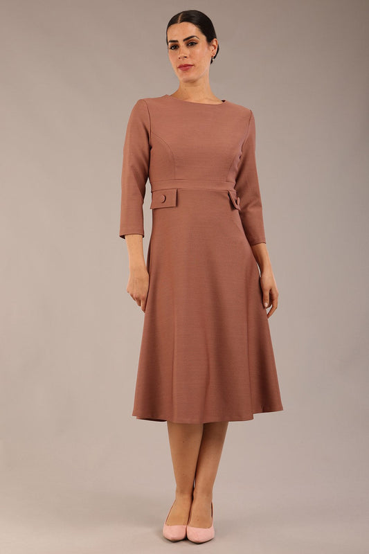 brunette Model wearing diva catwalk Gresham 3/4 Sleeve Knee Length A-Line Dress in Acorn brown colour front image with sunglasses