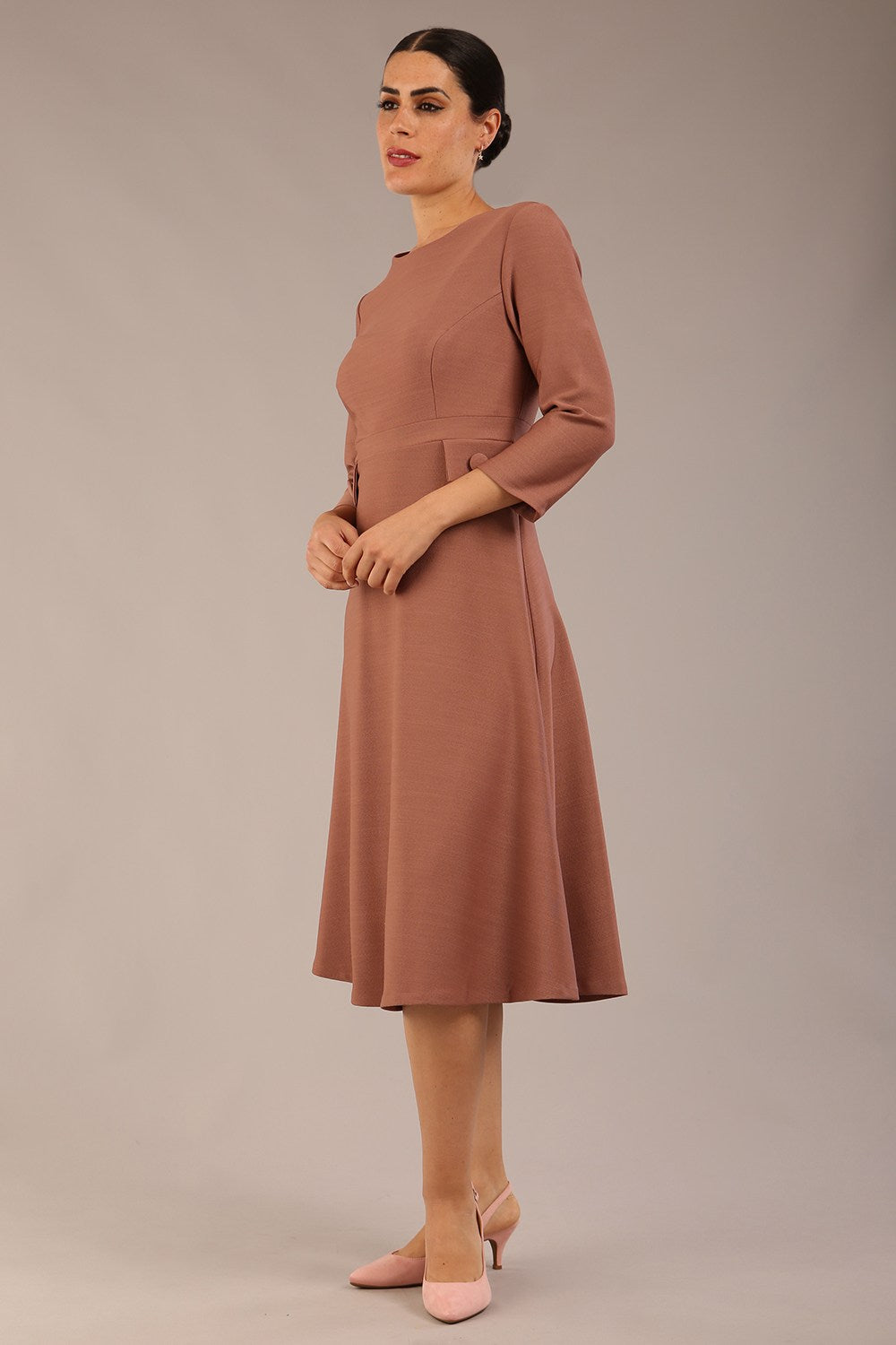 brunette Model wearing diva catwalk Gresham 3/4 Sleeve Knee Length A-Line Dress in Acorn brown colour front image with sunglasses