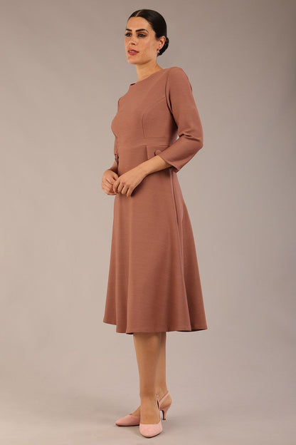 brunette Model wearing diva catwalk Gresham 3/4 Sleeve Knee Length A-Line Dress in Acorn brown colour front image with sunglasses