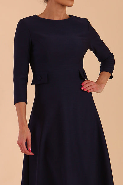 Model wearing diva catwalk Gresham 3/4 Sleeve Knee Length A-Line Dress in Navy Blue back