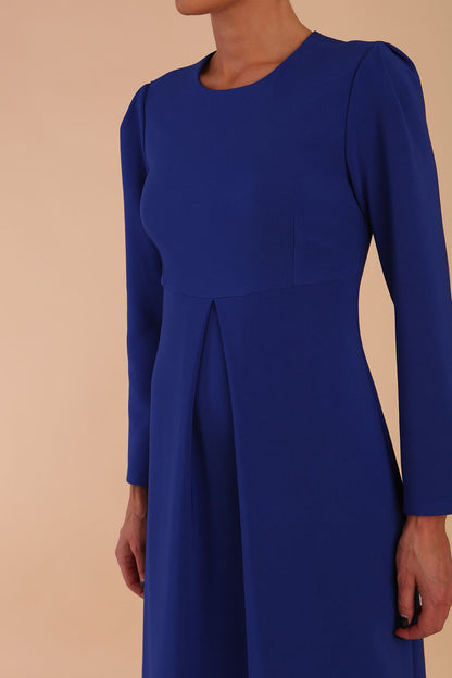 Model wearing diva catwalk in Bombay fabric the Epsom Long Sleeve and round neckline and midi A-Line Dress in Royal Blue colour front side (Royal Blue)