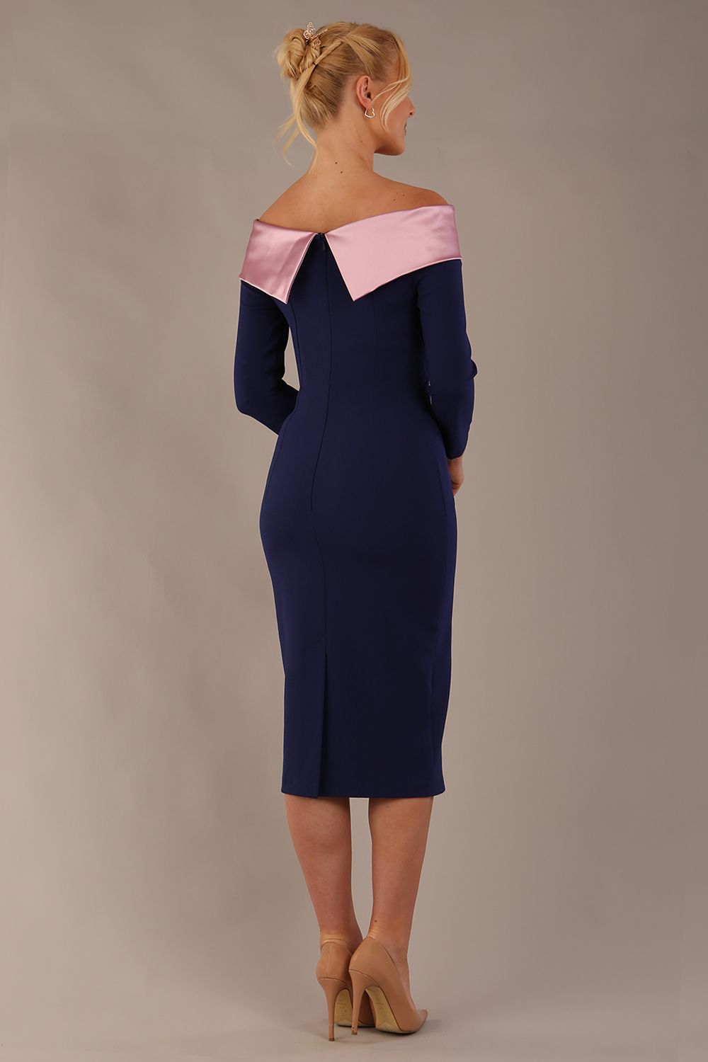 Model is wearing a diva catwalk Rosalind Off Shoulder Bow Detail Pencil Dress 3/4 sleeve in Navy Blue/Lilac Contrast contrast front image (Navy Blue / Lilac Contrast)