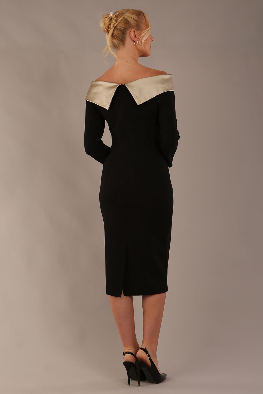 brunette Model is wearing a diva catwalk Rosalind Off Shoulder Bow Detail Pencil Dress 3/4 sleeve in Black/Champagne contrast front image (Black / Champagne Contrast)