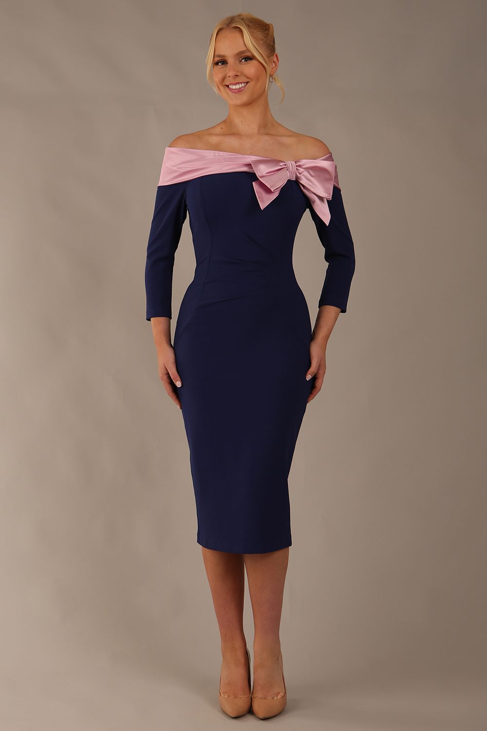 Model is wearing a diva catwalk Rosalind Off Shoulder Bow Detail Pencil Dress 3/4 sleeve in Navy Blue/Lilac Contrast contrast front image (Navy Blue / Lilac Contrast)