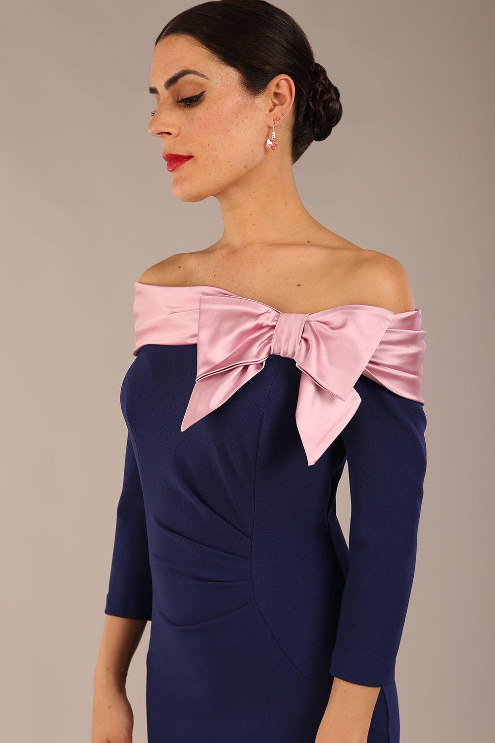 Model is wearing a diva catwalk Rosalind Off Shoulder Bow Detail Pencil Dress 3/4 sleeve in Navy Blue/Lilac Contrast contrast front image (Navy Blue / Lilac Contrast)