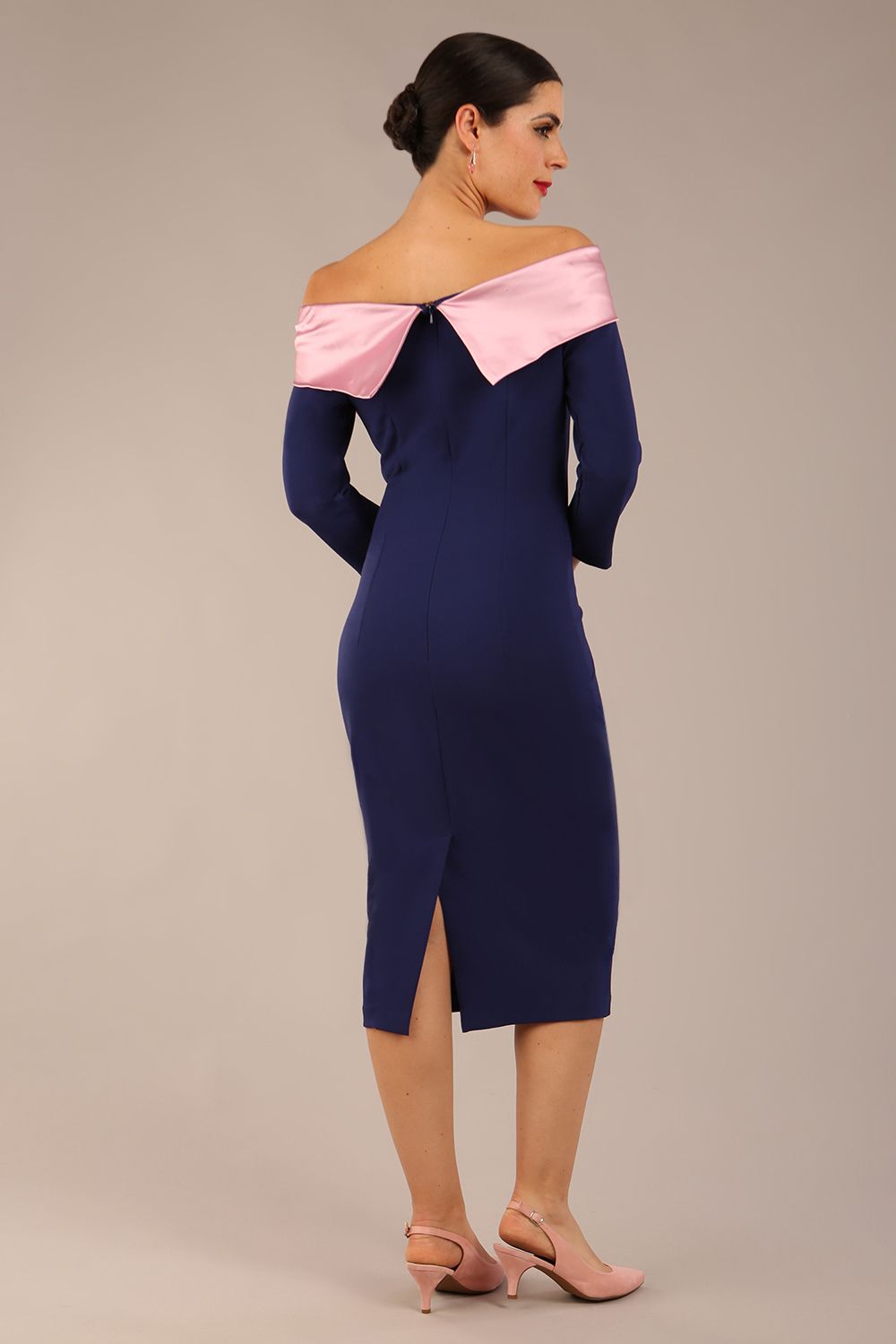 Model is wearing a diva catwalk Rosalind Off Shoulder Bow Detail Pencil Dress 3/4 sleeve in Navy Blue/Lilac Contrast contrast front image (Navy Blue / Lilac Contrast)