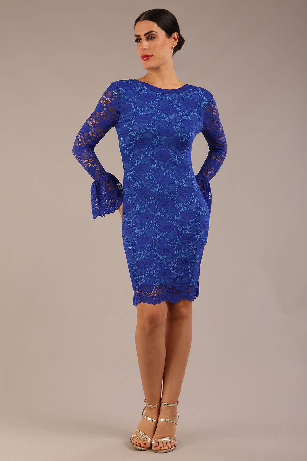 brunette model wearing a diva catwalk Tatiana fluted sleeved satin dress fluted long sleeves length pencil dress in cobalt blue lace colour front side