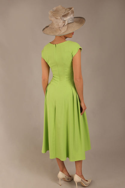 brunette model is wearing a diva catwalk Audrey a-line Dress sweetheart neckline and With Pockets and sleeveless with ankle length in lime green colour
