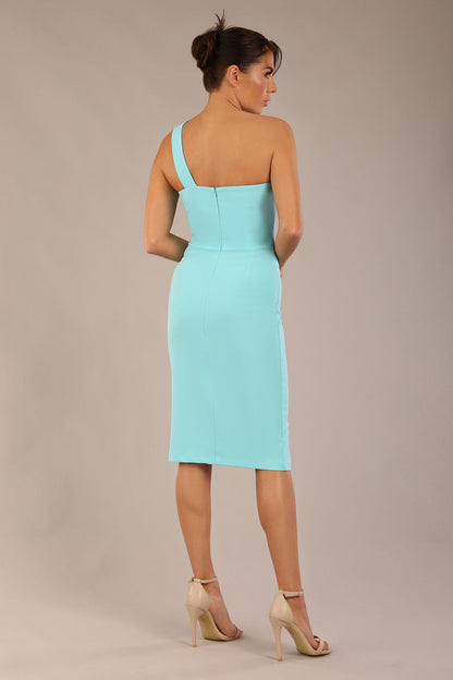 Model wearing a divacatwalk Sofia Pencil Dress knee length front side vent with diagonal halter neck in turquoise colour front