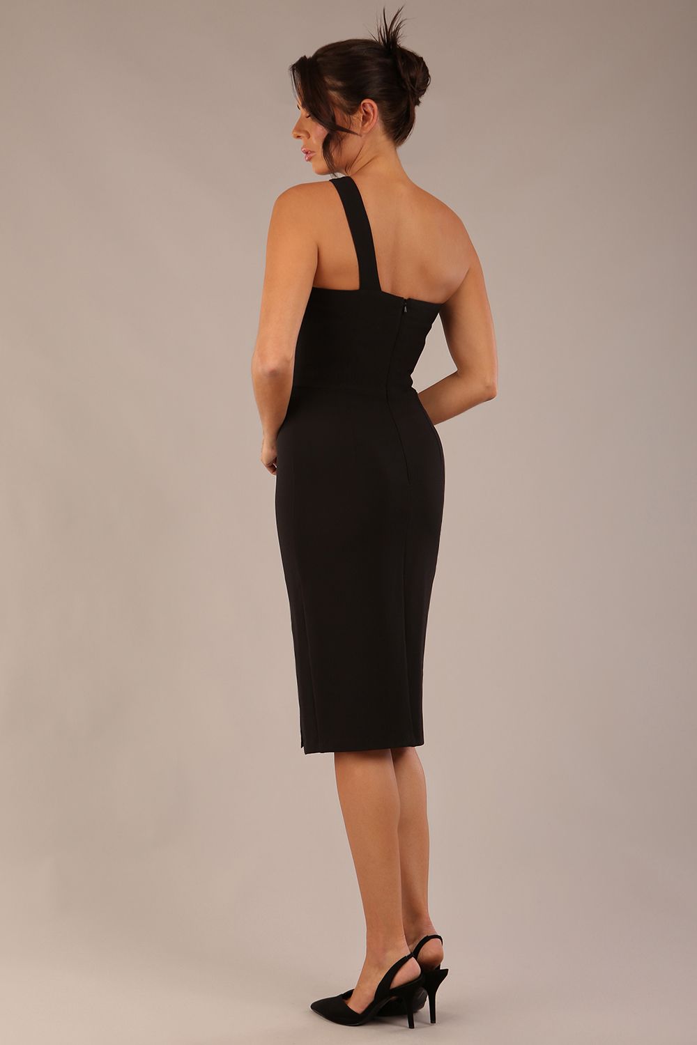 Model wearing a divacatwalk Sofia Pencil Dress knee length front side vent with diagonal halter neck in black colour front