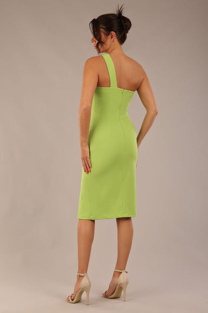 Model wearing a divacatwalk Sofia Pencil Dress knee length front side vent with diagonal halter neck in lime green front