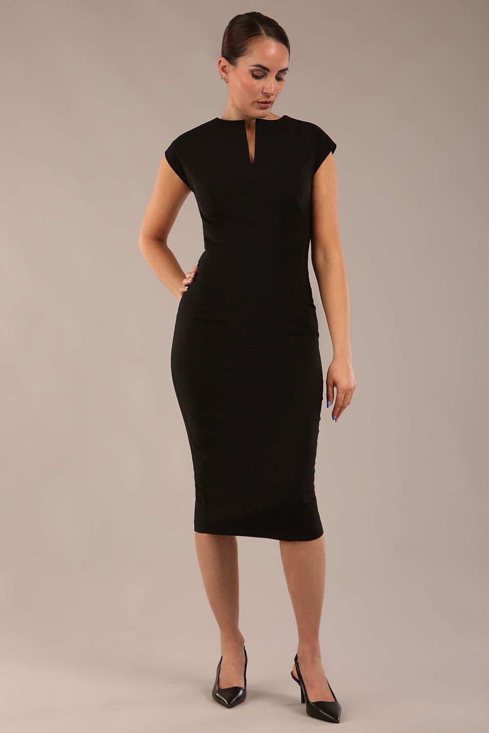 brunette model is wearing a diva catwalk Claire Cap Sleeve Pencil Dress cap sleeve with round neckline with v-slit and knee length in black colour front (Black)