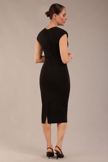 brunette model is wearing a diva catwalk Claire Cap Sleeve Pencil Dress cap sleeve with round neckline with v-slit and knee length in black colour front (Black)