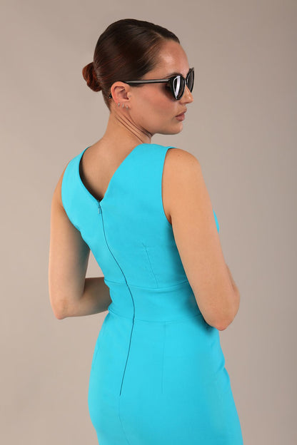brunette model is wearing a diva catwalk Carrie Pencil Wiggle Dress sleeveless v neck front and back knee length in azure blue colour front image