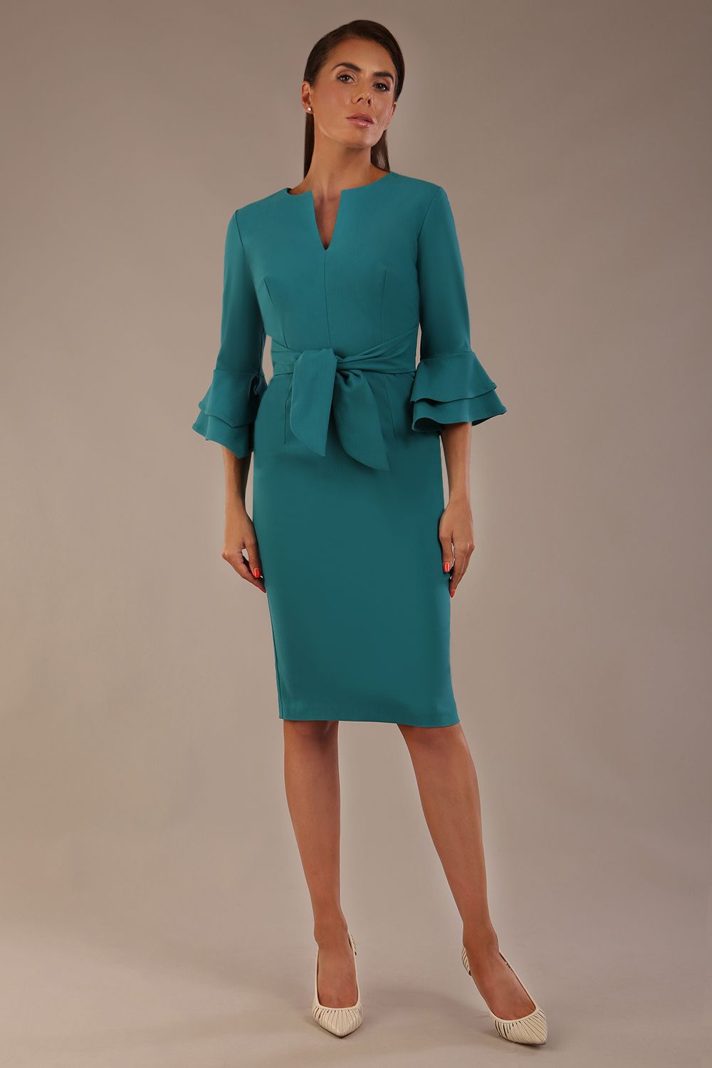 brunette model is wearing a diva catwalk Hobson ruffled sleeves Pencil Dress with tie waistband knee length in Teal Green colour front (Teal Green)