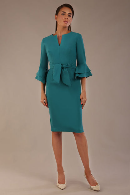 brunette model is wearing a diva catwalk Hobson ruffled sleeves Pencil Dress with tie waistband knee length in Teal Green colour front (Teal Green)
