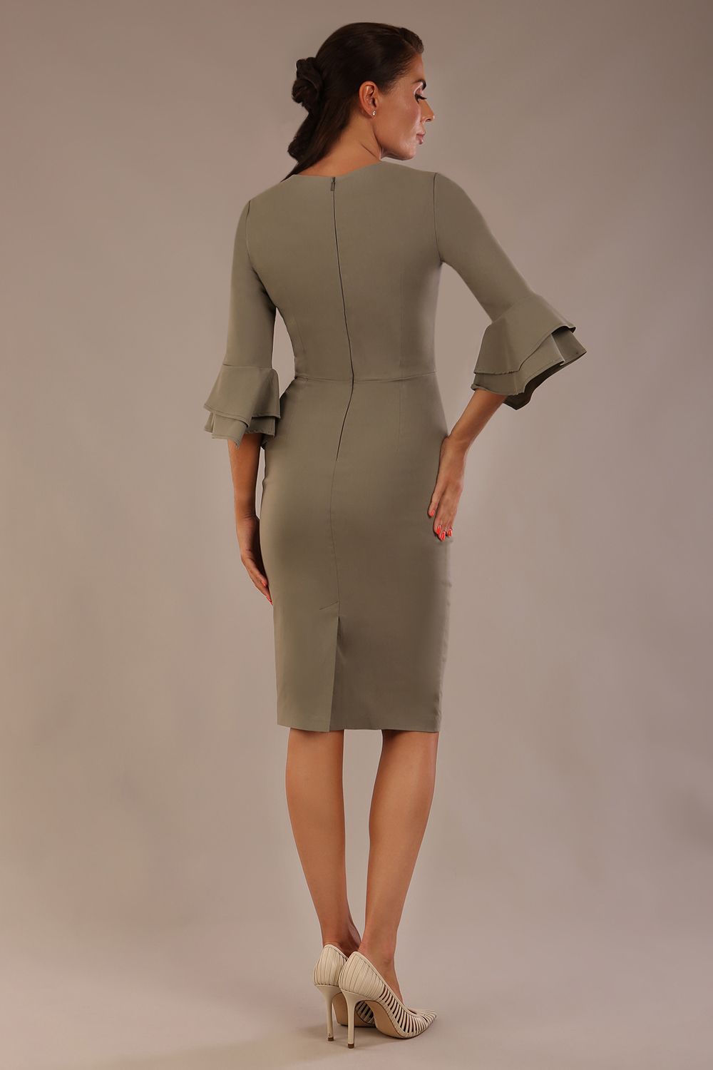 brunette model is wearing a diva catwalk Hobson ruffled sleeves Pencil Dress with tie waistband knee length in Castlerock Grey colour front (Castlerock Grey)