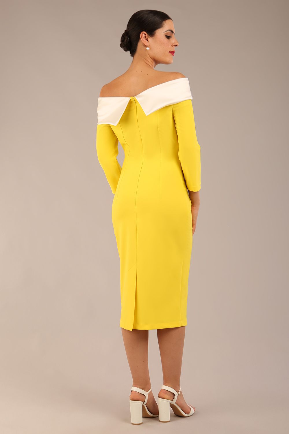 brunette Model is wearing a Rosalind Off Shoulder Bow Detail Pencil Dress 3/4 sleeve in Blazing Yellow / Ivory cream contrast front image (Blazing Yellow / Ivory)