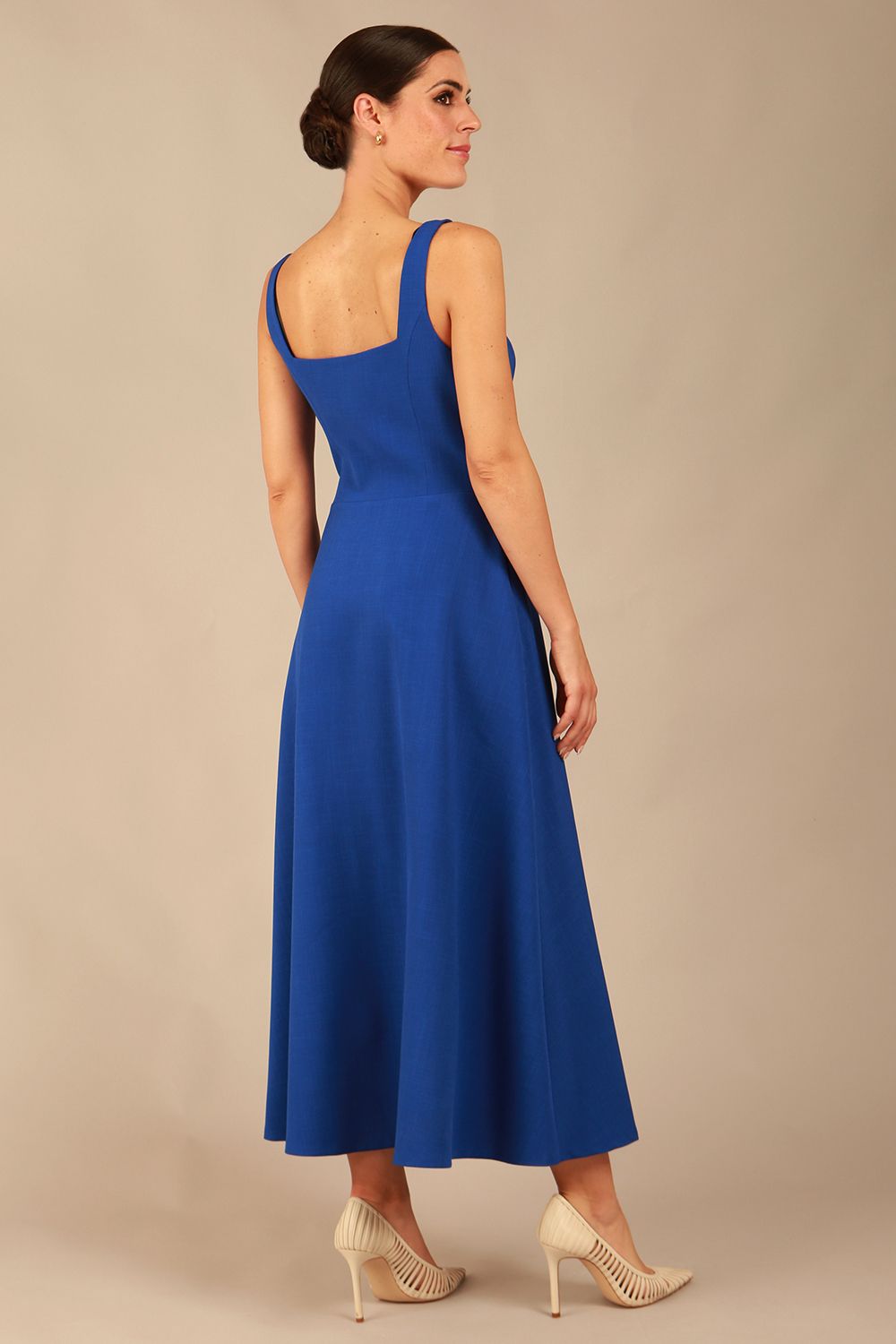 model wearing a diva catwalk Tamsin Square Neckline Swing Dress sleeveless style with a midaxi  length and side pockets in cobalt blue colour (Cobalt blue)