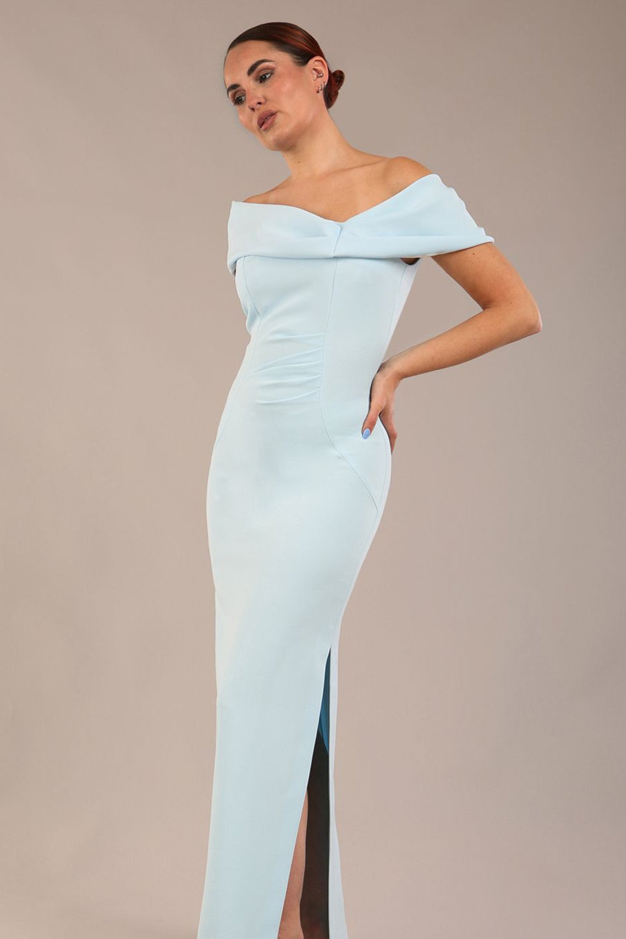 brunette model is wearing a diva catwalk Mariposa Longer Length Dress off the shoulder bardot neckline and midaxi length in sky blue colour front image