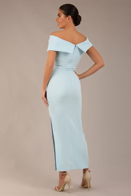 brunette model is wearing a diva catwalk Mariposa Longer Length Dress off the shoulder bardot neckline and midaxi length in sky blue colour front image