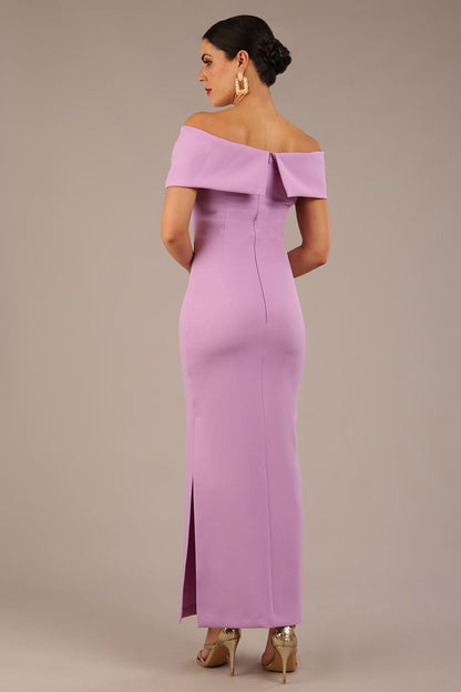 brunette model is wearing a diva catwalk Mariposa Longer Length Dress off the shoulder bardot neckline and midaxi length in sheer lilac colour front image