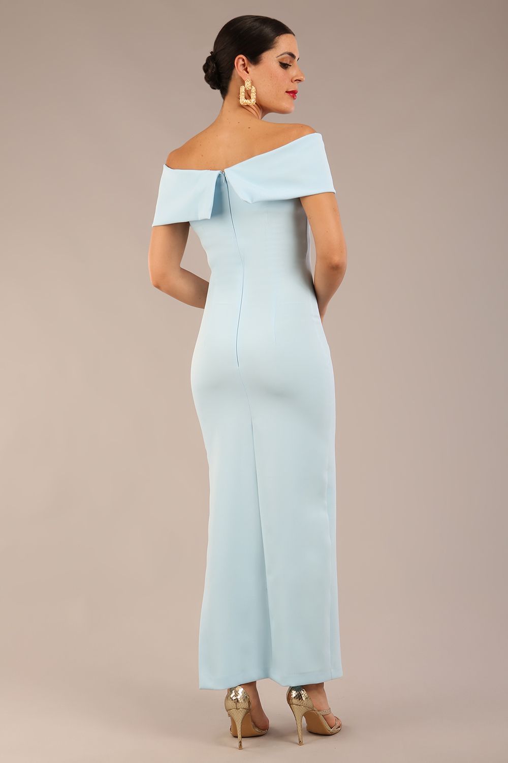 brunette model is wearing a diva catwalk Mariposa Longer Length Dress off the shoulder bardot neckline and midaxi length in sky blue colour front image