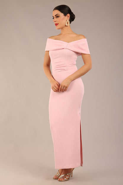 brunette model is wearing a diva catwalk Mariposa Longer Length Dress off the shoulder bardot neckline and midaxi length in crystal pink colour front image close up