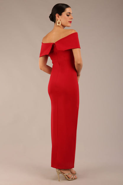 brunette model is wearing a diva catwalk Mariposa Longer Length Dress off the shoulder bardot neckline and midaxi length in dark red colour front image
