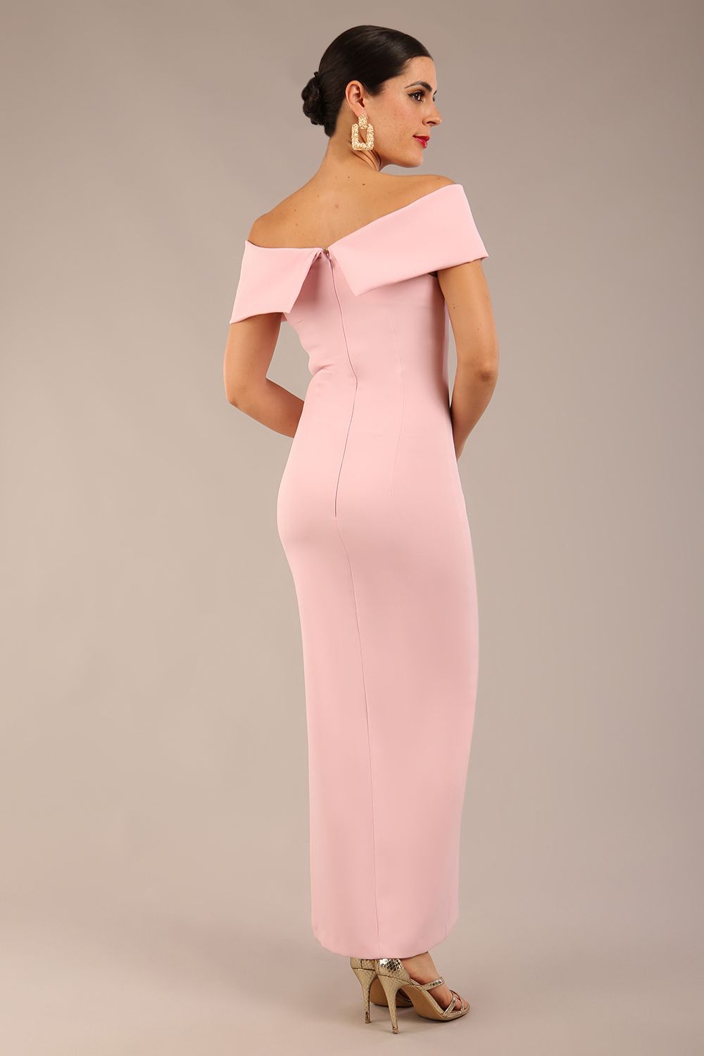 brunette model is wearing a diva catwalk Mariposa Longer Length Dress off the shoulder bardot neckline and midaxi length in crystal pink colour front image close up