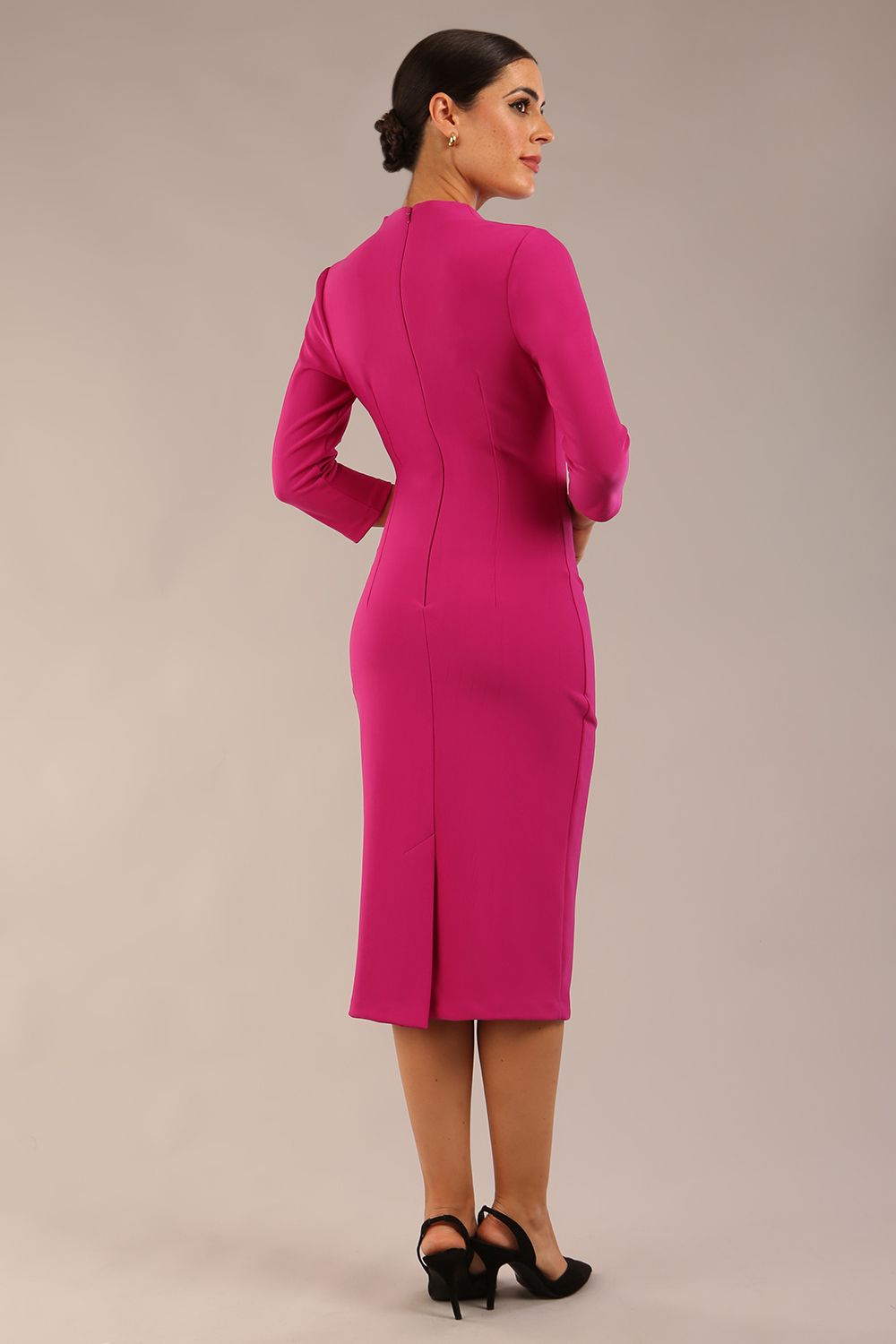 model wearing a diva catwalk Asymetric 3/4 Sleeves Pencil Dress with 3/4 sleeves knee length and asymmetric neckline in magenta haze colour front image