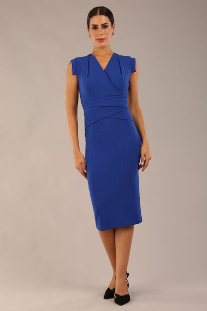 model wearing a diva catwalk Caprice Cap Sleeved Pencil Dress cap sleeve v neckline knee length with pleating details in cobalt blue colour