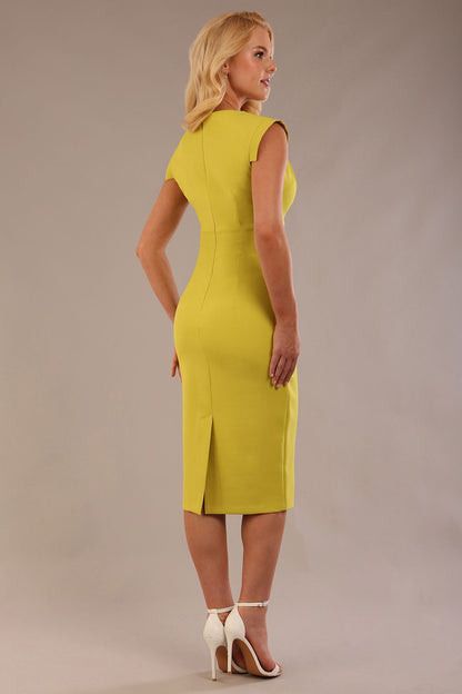 model wearing a diva catwalk Caprice Cap Sleeved Pencil Dress cap sleeve v neckline knee length with pleating details in citrus green colour front