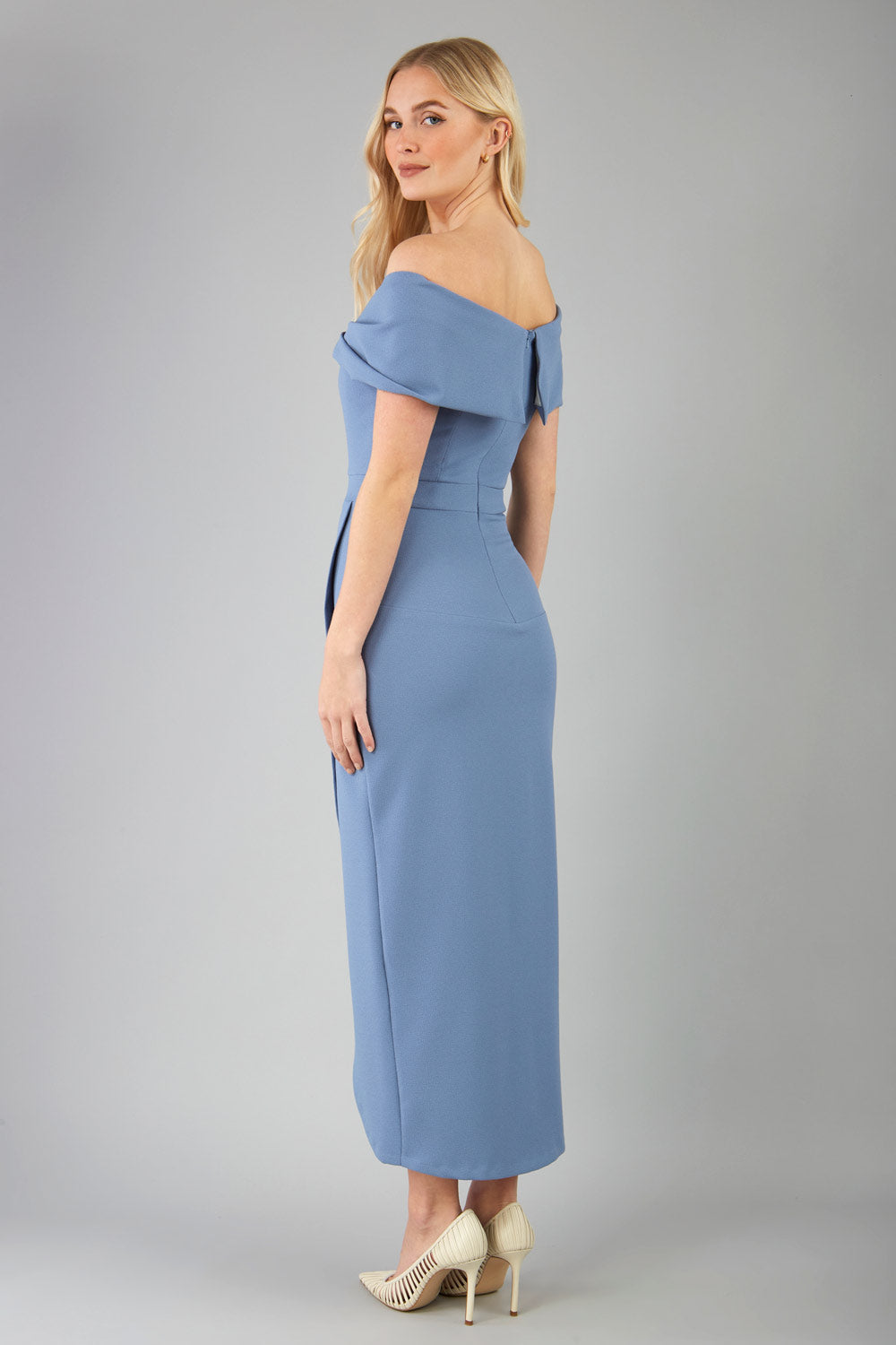 model wearing diva catwalk vegas calf length stone blue midaxi dress with wide bardot neckline and open shoulders with a large opening at the front of the skirt with pleating coming down long skirt front (Stone Blue)