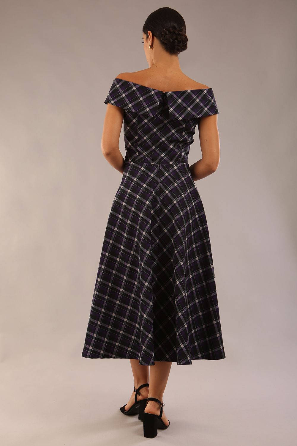 model is wearing a diva catwalk Montclair Tartan Off-Shoulder Midi Dress bardot neckline with tie detail at the waist area a-line style in royal purple tartan colour (Royal Purple Tartan)