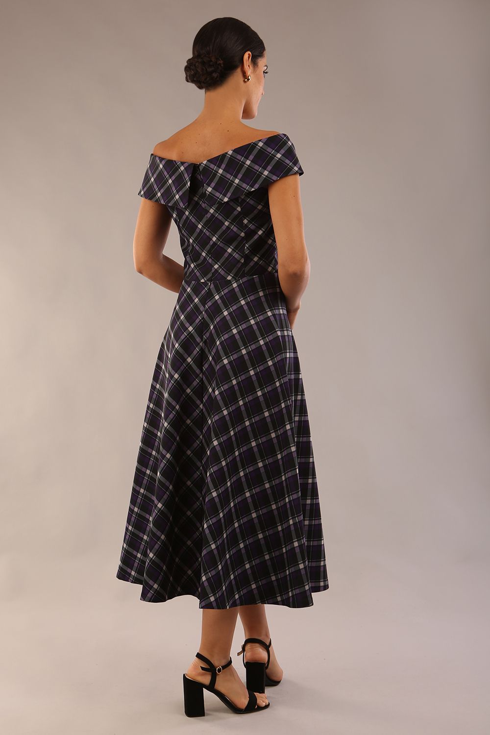 model is wearing a diva catwalk Montclair Tartan Off-Shoulder Midi Dress bardot neckline with tie detail at the waist area a-line style in royal purple tartan colour (Royal Purple Tartan)
