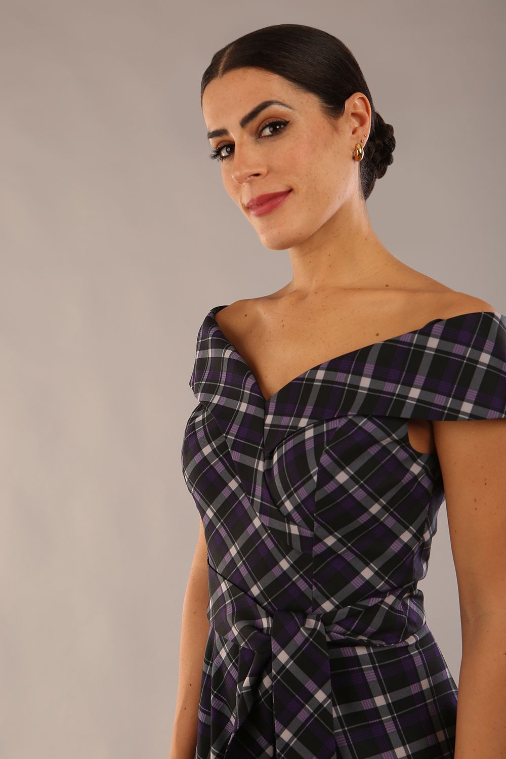 model is wearing a diva catwalk Montclair Tartan Off-Shoulder Midi Dress bardot neckline with tie detail at the waist area a-line style in royal purple tartan colour (Royal Purple Tartan)
