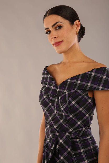 model is wearing a diva catwalk Montclair Tartan Off-Shoulder Midi Dress bardot neckline with tie detail at the waist area a-line style in royal purple tartan colour (Royal Purple Tartan)
